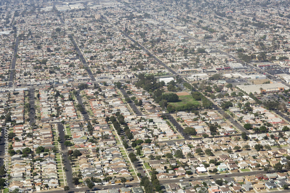 Aerial view of Los Angeles in the United States City landscape with roofs of houses and roads.
