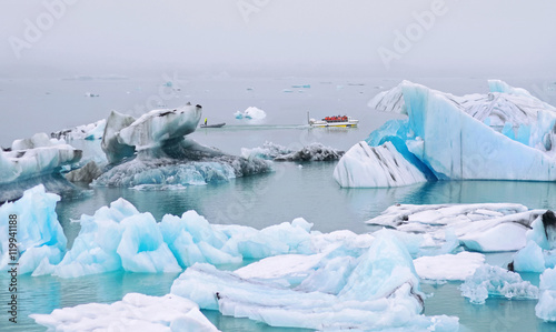 Amphibious vehicle takes tourists on iceberg watching tour in Jokulsarlon lagoon in Southern Iceland ,where huge chunks of ice from the Vatnajokull glacier float out to the Atlantic ocean 