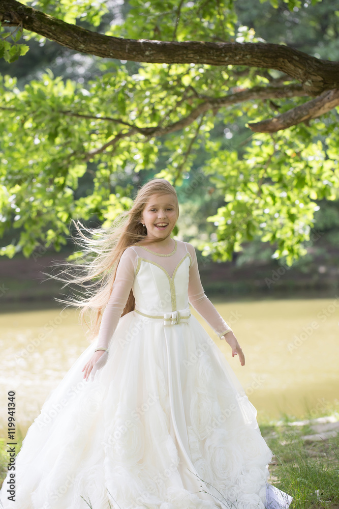 small girl in white dress outdoor