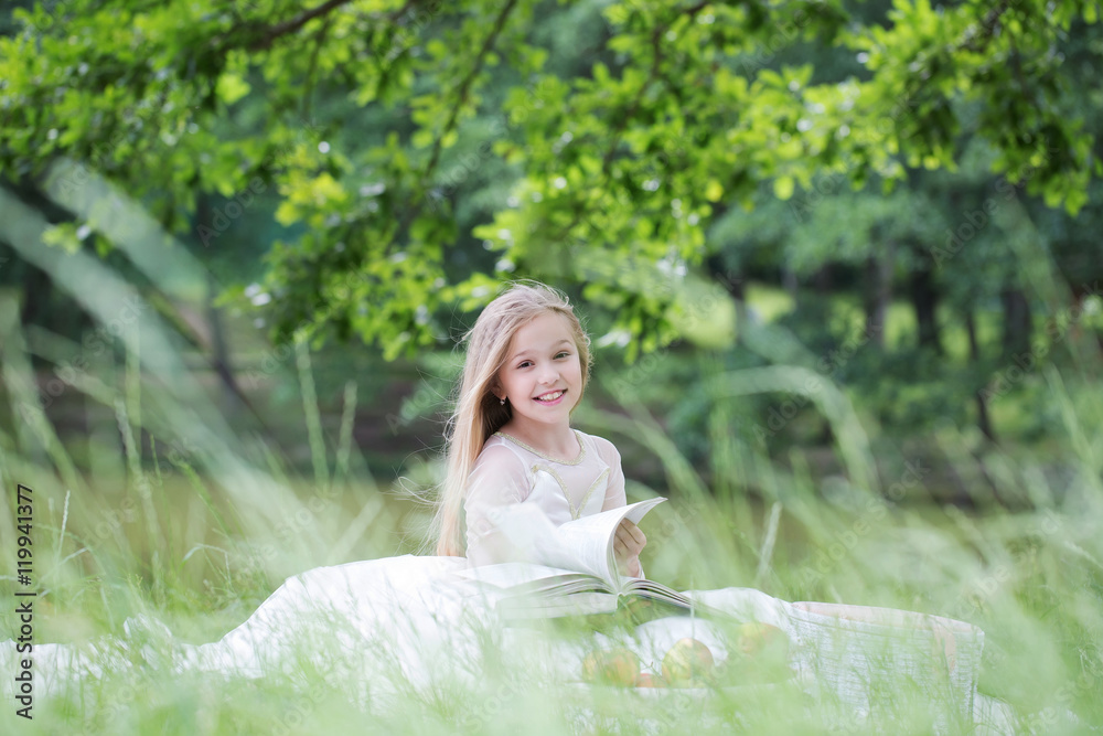 small girl in dress with fruit basket and book small girl in dress with fruit basket and book