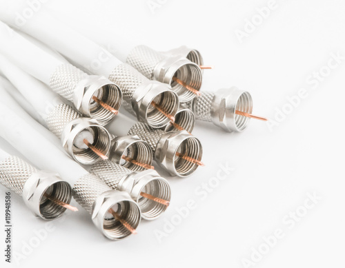 Nuts on the coaxial cable on a white background photo