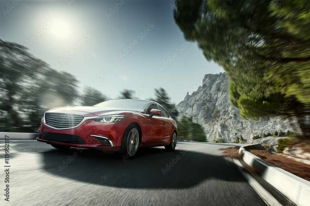 Fototapeta premium Red car speed driving on asphalt road near mountain at daytime