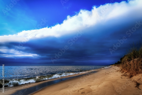 Weird Weather Phenomenon. Cloud Ceiling. Sandy Beach Lakeshore with Impressive Copy Space.