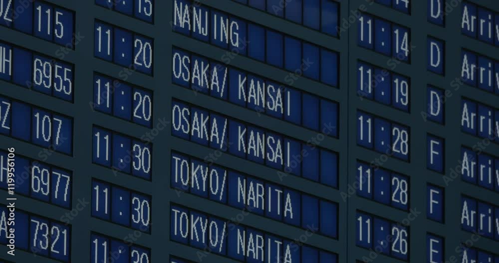 Flight schedule at the airport displayed in Korean, English and Japanese languages