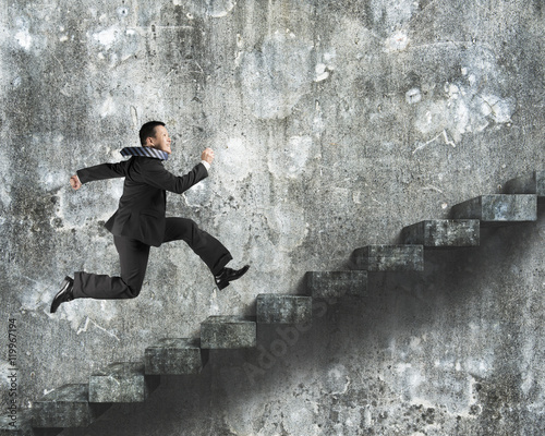 Man running on old dirty concrete stairs