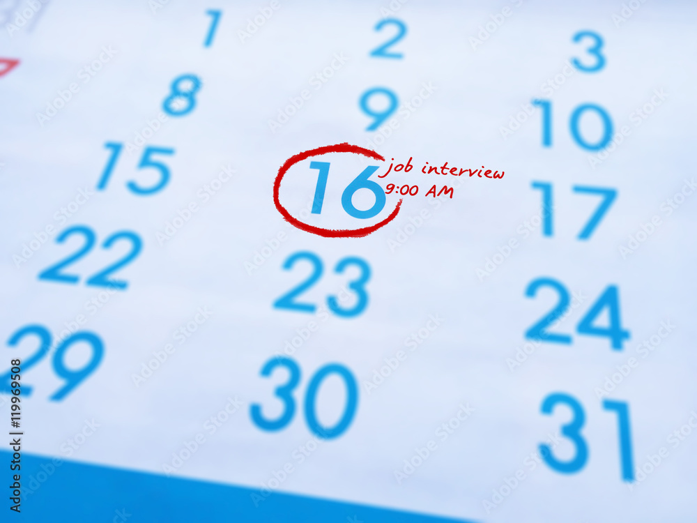 Reminders job Interview at 9 am word written on calendar.Important reminder. Reminders job Interview at 9 am word written on calendar.Important reminder.