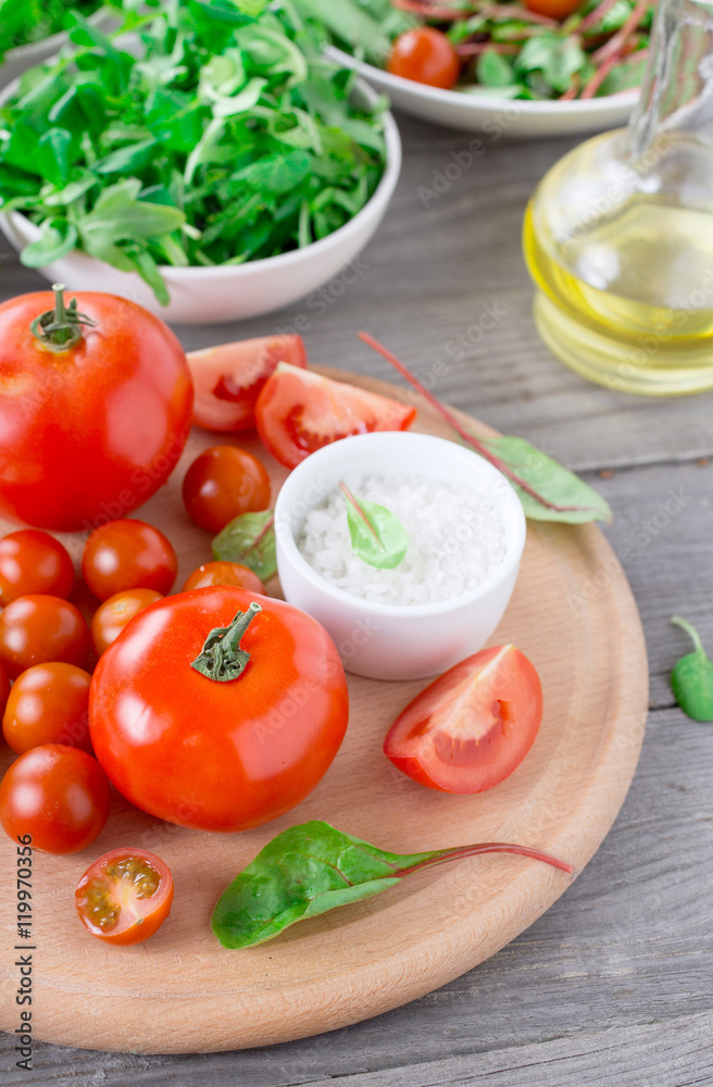 Set of different tomatoes on a wooden table Set of different tomatoes on a wooden table