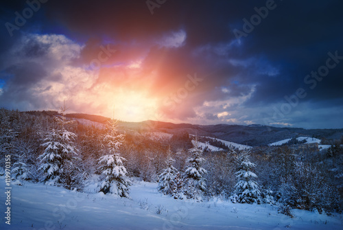 Bright sunrise in a Carpathian mountain valley