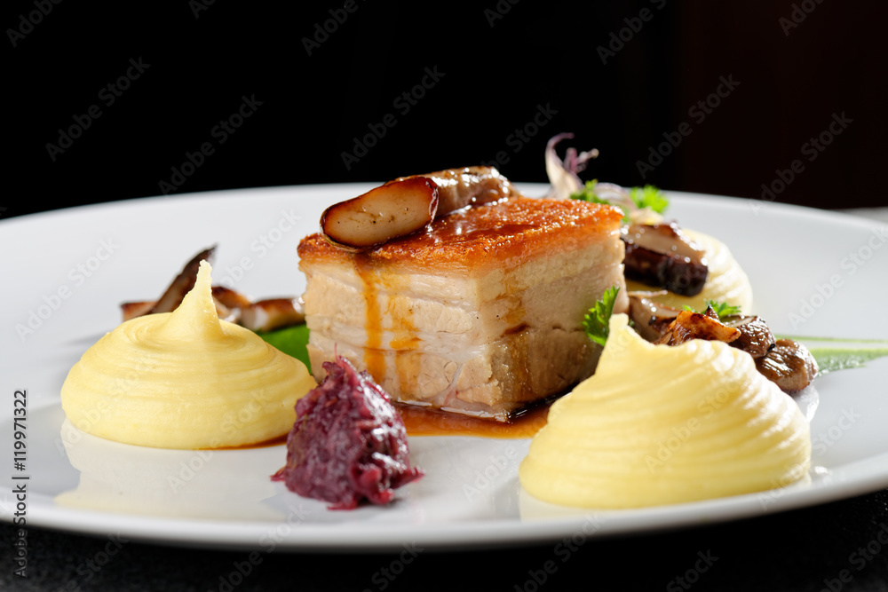 Plated freshly grilled pork belly with potato and mushrooms/fine dining Plated freshly grilled pork belly with potato and mushrooms/fine dining