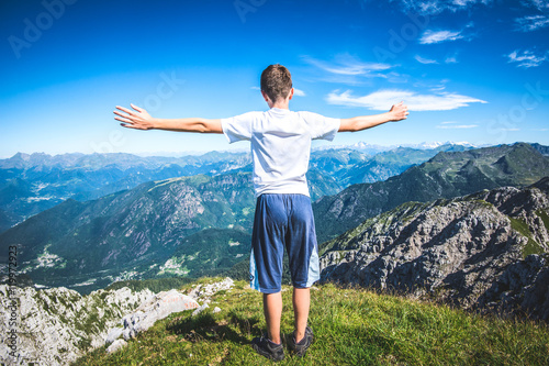 holidays in mountain - boy contemplate the view 