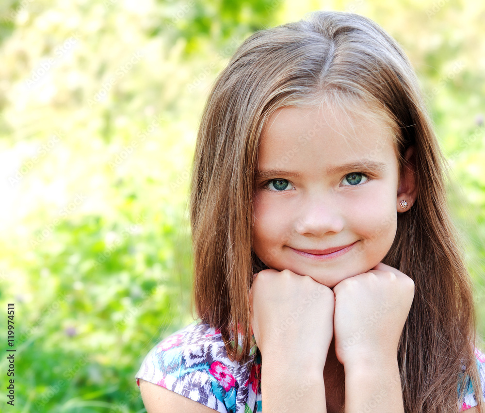 Portrait of adorable smiling little girl in summer day Portrait of adorable smiling little girl in summer day