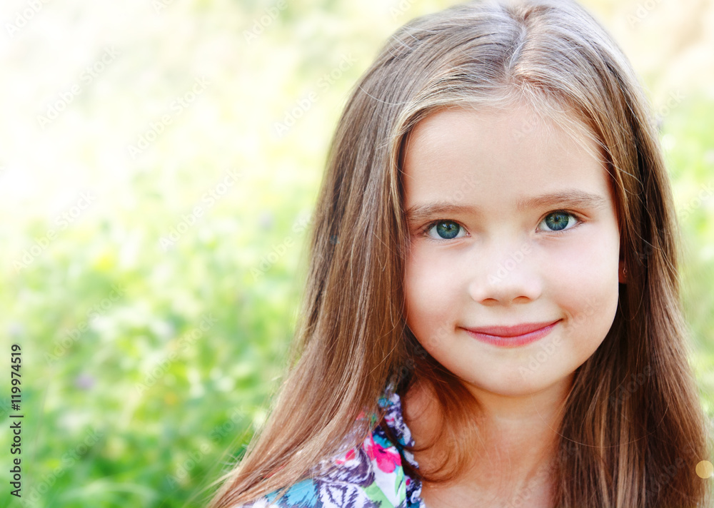 Portrait of adorable smiling little girl in summer day Portrait of adorable smiling little girl in summer day
