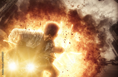 Woman on a motor bike on exploding background photo