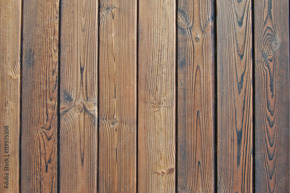 Naklejka premium Old wooden fence. wood palisade background.