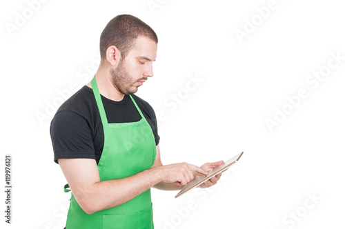 Successful salesperson reading something on tablet