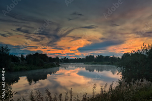 Dramatic Sunset Over The Misty River © k009034