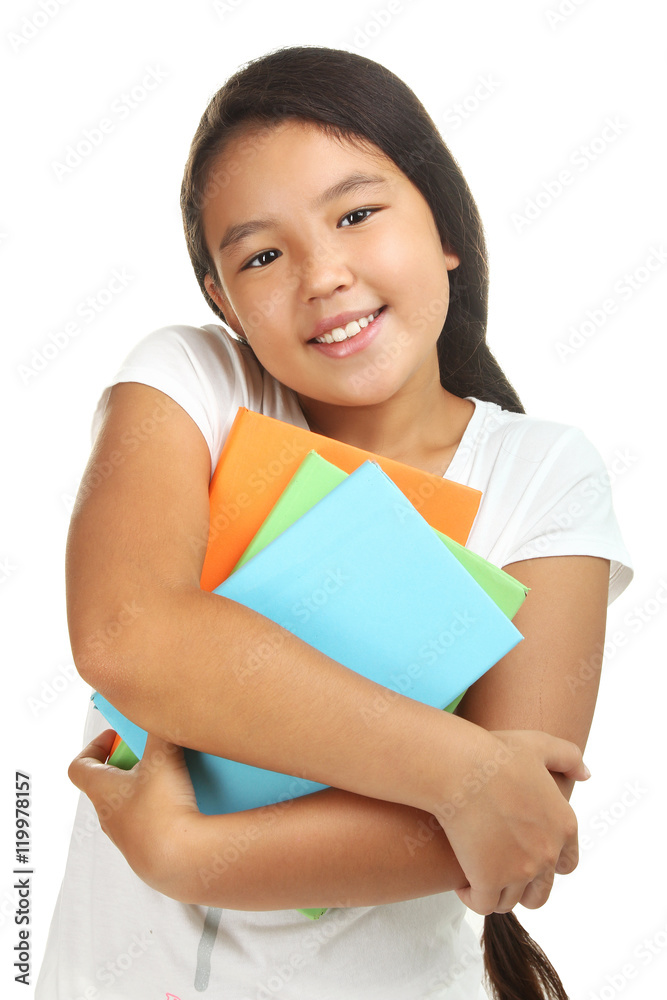 Cheerful little girl with books in hand. Isolated on white background Cheerful little girl with books in hand. Isolated on white background