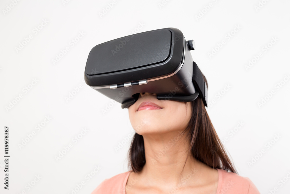 Asian Woman looking though VR device Asian Woman looking though VR device
