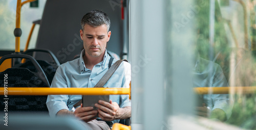 Businessman traveling by bus