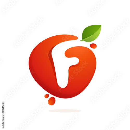 Letter F logo in fresh juice splash with green leaves.