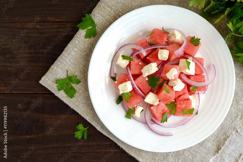 Dietary salad from fresh watermelon, blue onion and goat cheese (feta). top view Dietary salad from fresh watermelon, blue onion and goat cheese (feta). top view