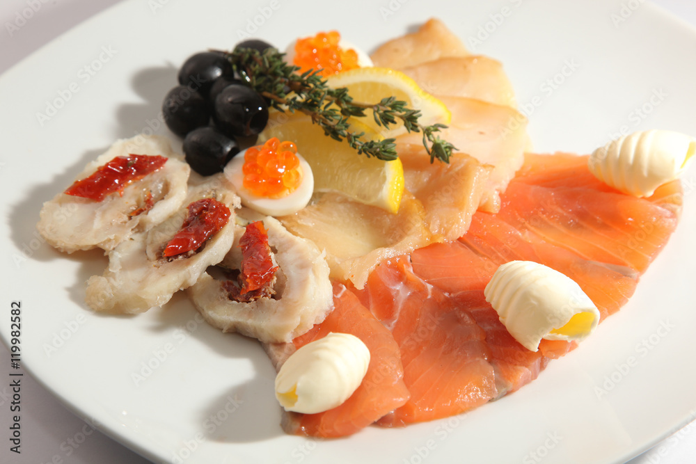 cutting of different fish with caviar and butter