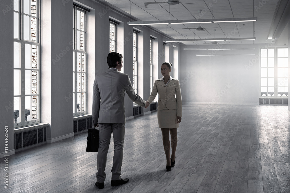 Business partners handshake . Mixed media
