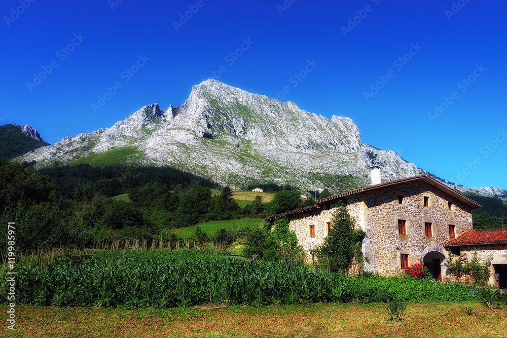 Basque farmhouse under Anboto mountain in Basque Country