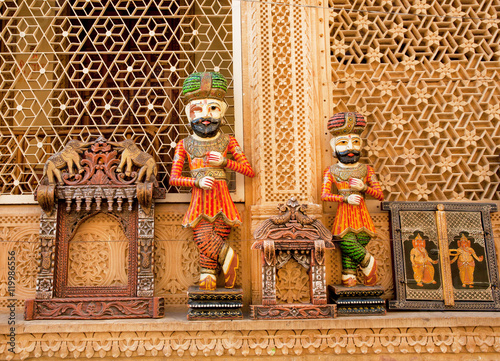 Wooden figures of Rajasthan men on flea market, India