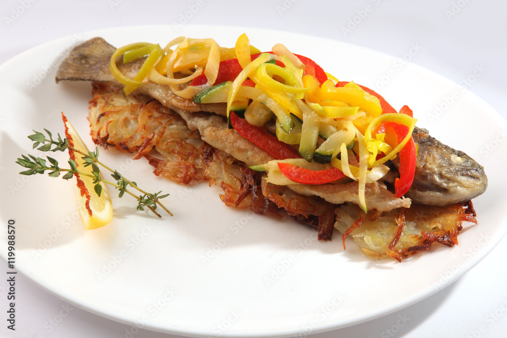 Roast fish with potatoes and vegetables