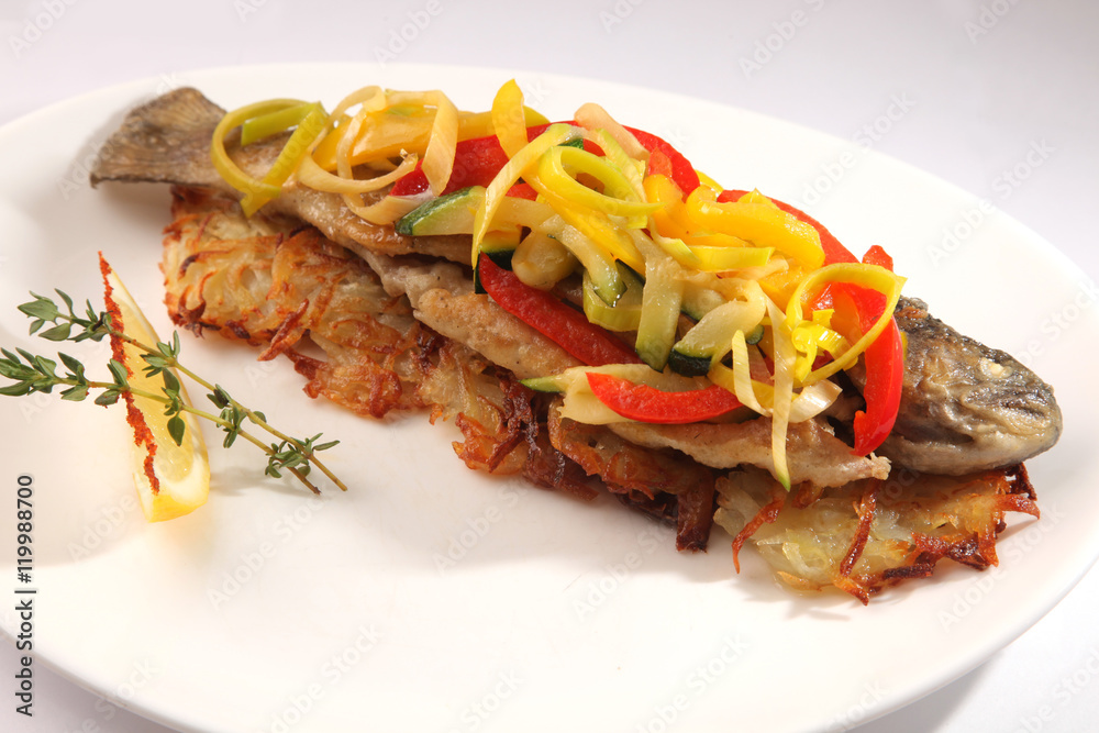Roast fish with potatoes and vegetables