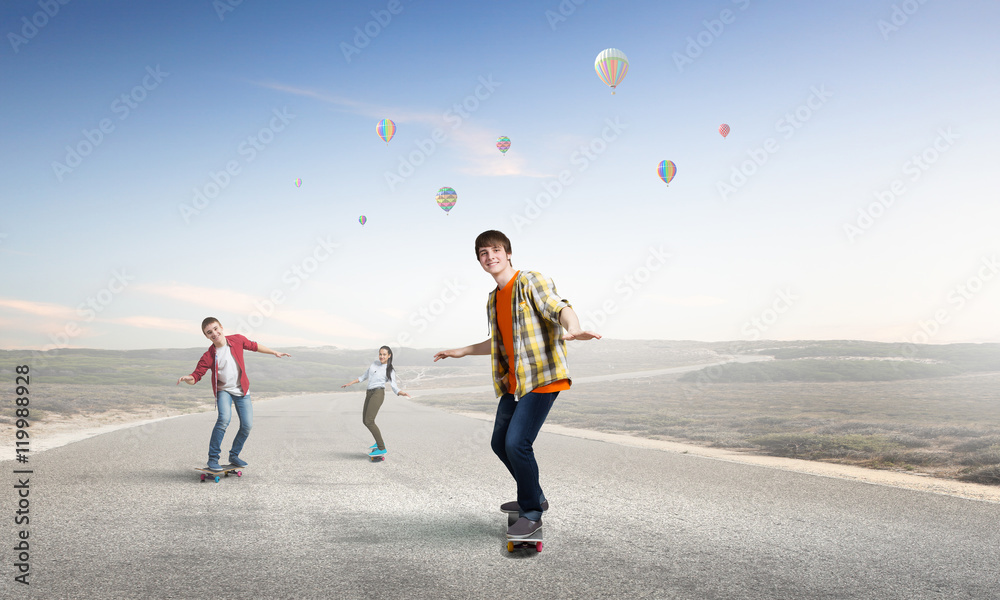 Teenagers ride skateboard . Mixed media Teenagers ride skateboard . Mixed media