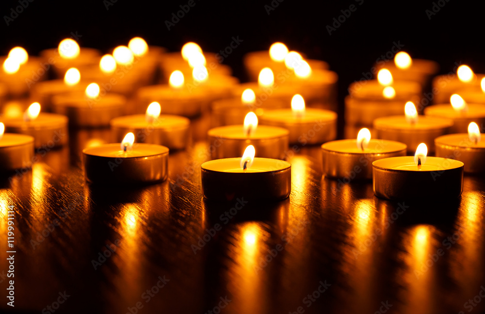 Many burning candles with shallow depth of field