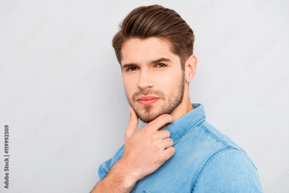 Portrait of handsome thoughtful man touching his chin Portrait of handsome thoughtful man touching his chin