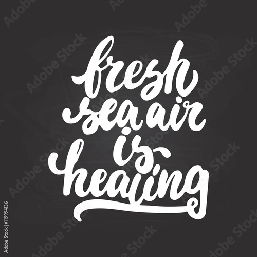 Fresh sea air is healing - hand drawn lettering phrase isolated on the chalkboard background. Fun brush ink inscription for photo overlays, greeting card or t-shirt print, poster design