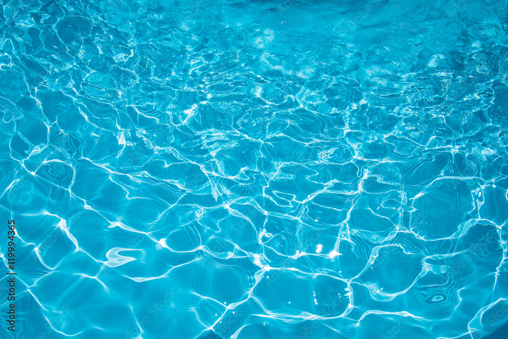 Ripple Water in swimming pool with sun reflection, Blue water abstract