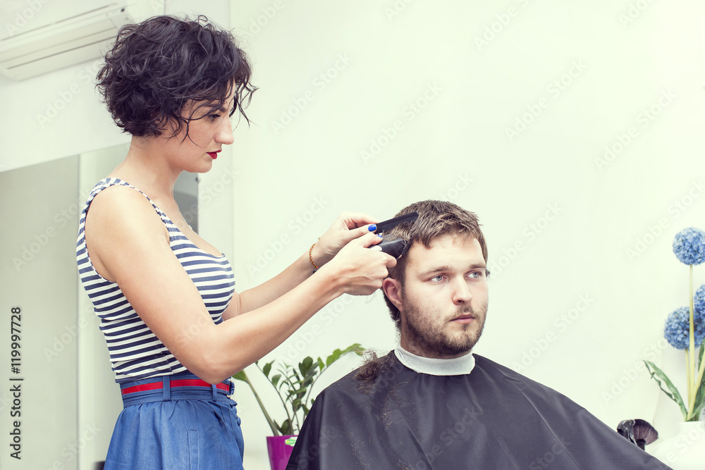 The young man at the hairdresser salon hairstyle make model The young man at the hairdresser salon hairstyle make model