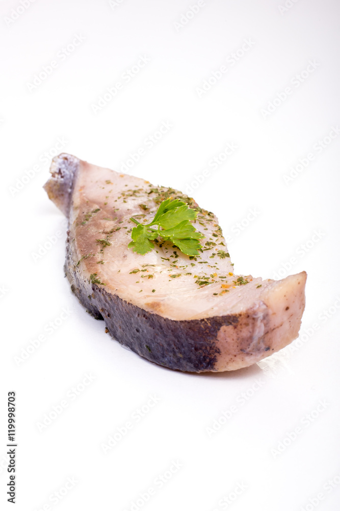 a piece of fish on a white background, photo studio, isolated, herbs, meal a piece of fish on a white background, photo studio, isolated, herbs, meal