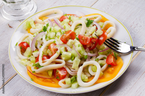 Squid  tomato  onion and greens salad