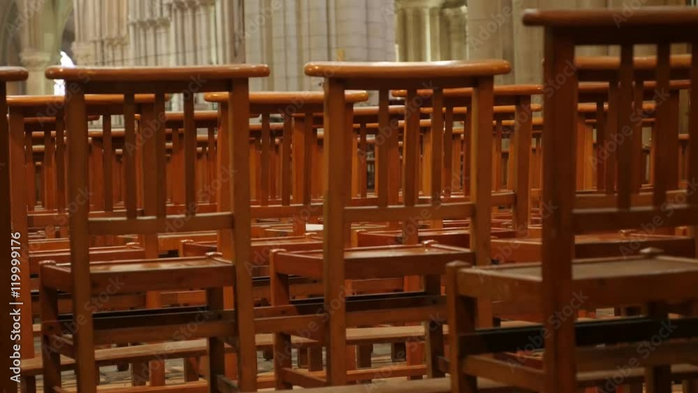 Behind empty cathedral wooden chairs in a row worship building 4K 3840X2160 30fps UltraHD footage - Row of wooden seats in Christian church 4K 2160p UHD video 