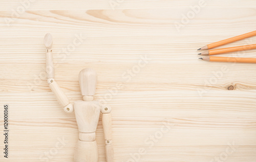 Wooden figure and office supplies