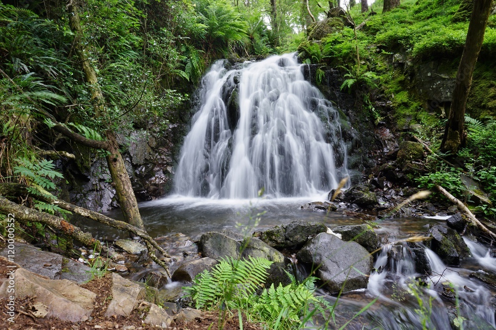 A waterfall in the Lake District of Cumbria, in Northern England A waterfall in the Lake District of Cumbria, in Northern England