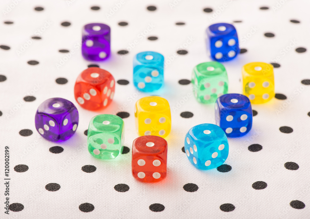 Colorful dice in close up. Concept image of leisure game, risk and chance. Symbol of success or luck. Colorful dice in close up. Concept image of leisure game, risk and chance. Symbol of success or luck.