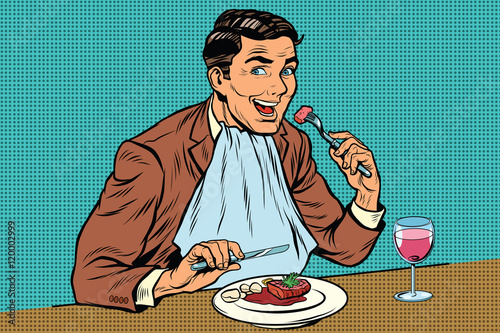 Elegant retro man eats in the restaurant and drinking wine