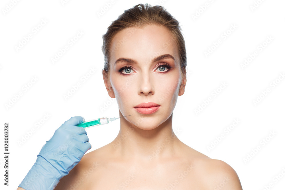 woman face and hand with syringe making injection