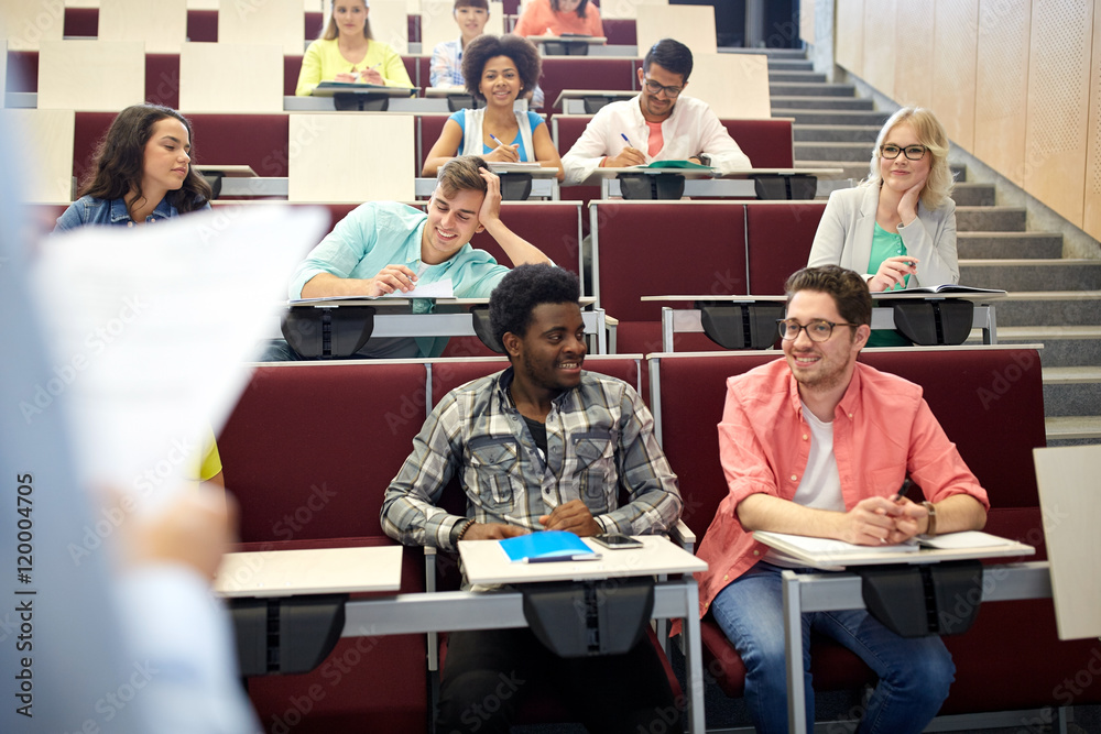 group of students with notebooks at lecture hall group of students with notebooks at lecture hall