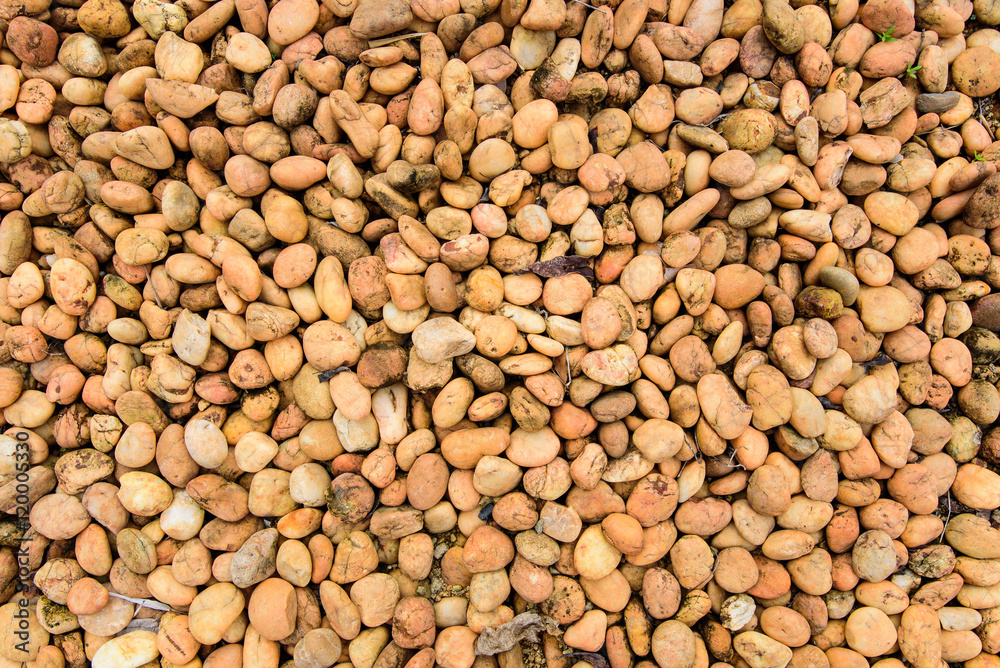 Orange brown rock pebbles background Orange brown rock pebbles background
