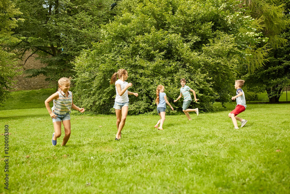 Obraz premium happy kids running and playing game outdoors
