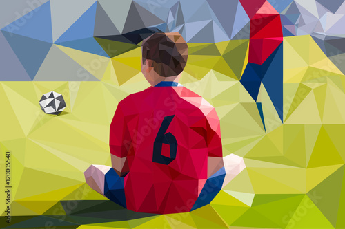 Young boy as a soccer player in grass field. Football background made with triangles. Low Poly Vector Art