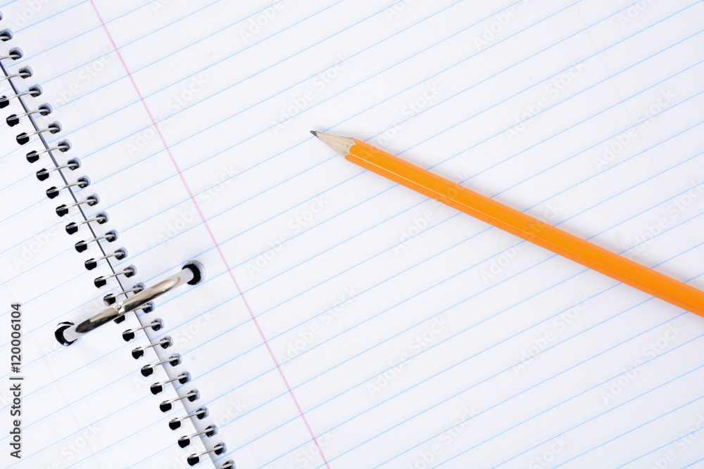 blank notebook paper and a yellow pencil blank notebook paper and a yellow pencil